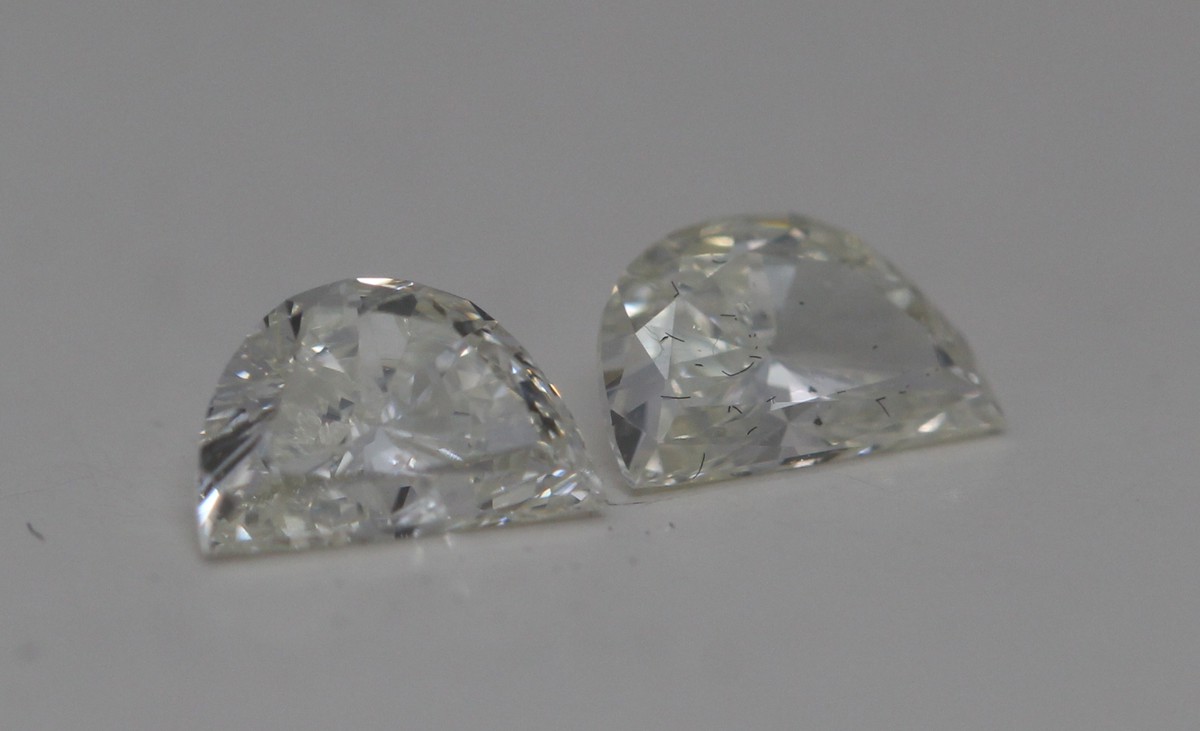 A Pair Of Half Moon Cut Loose Diamonds (0.57 Ct,J Color,Si1-Si2 Clarity)