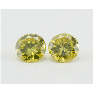 A Pair of Round Cut Loose Diamonds (0.9 Ct, Fancy Yellow (Color Irradiated)  Color, I1-I2 Clarity)